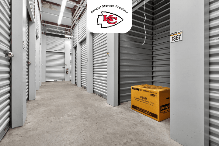 open self storage unit with a StorageMart moving box inside